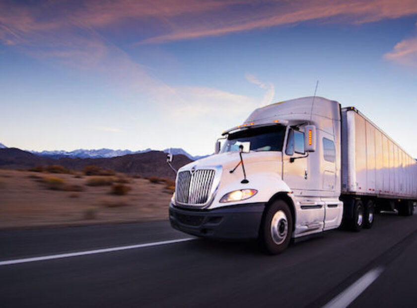 26129984 - truck and highway at sunset - transportation background