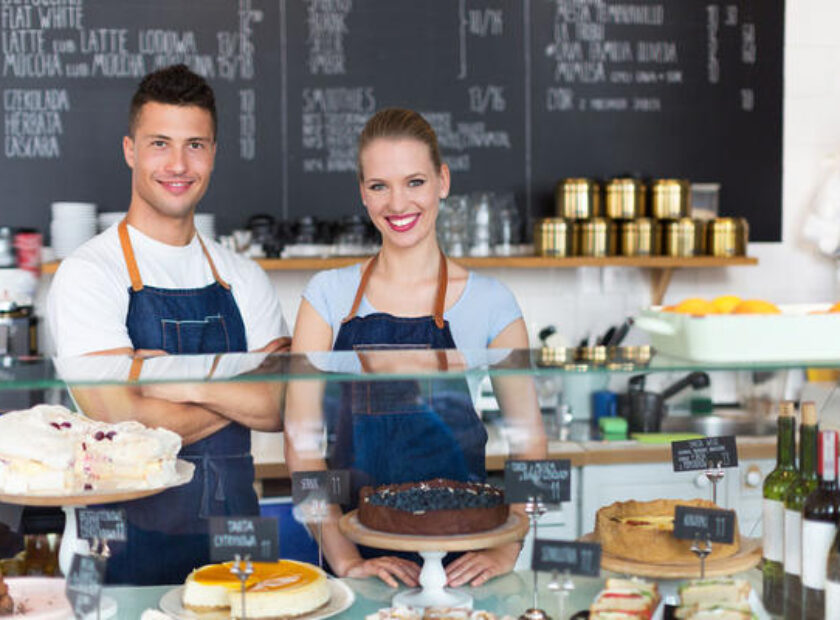 47219690 - man and woman working in a coffee shop